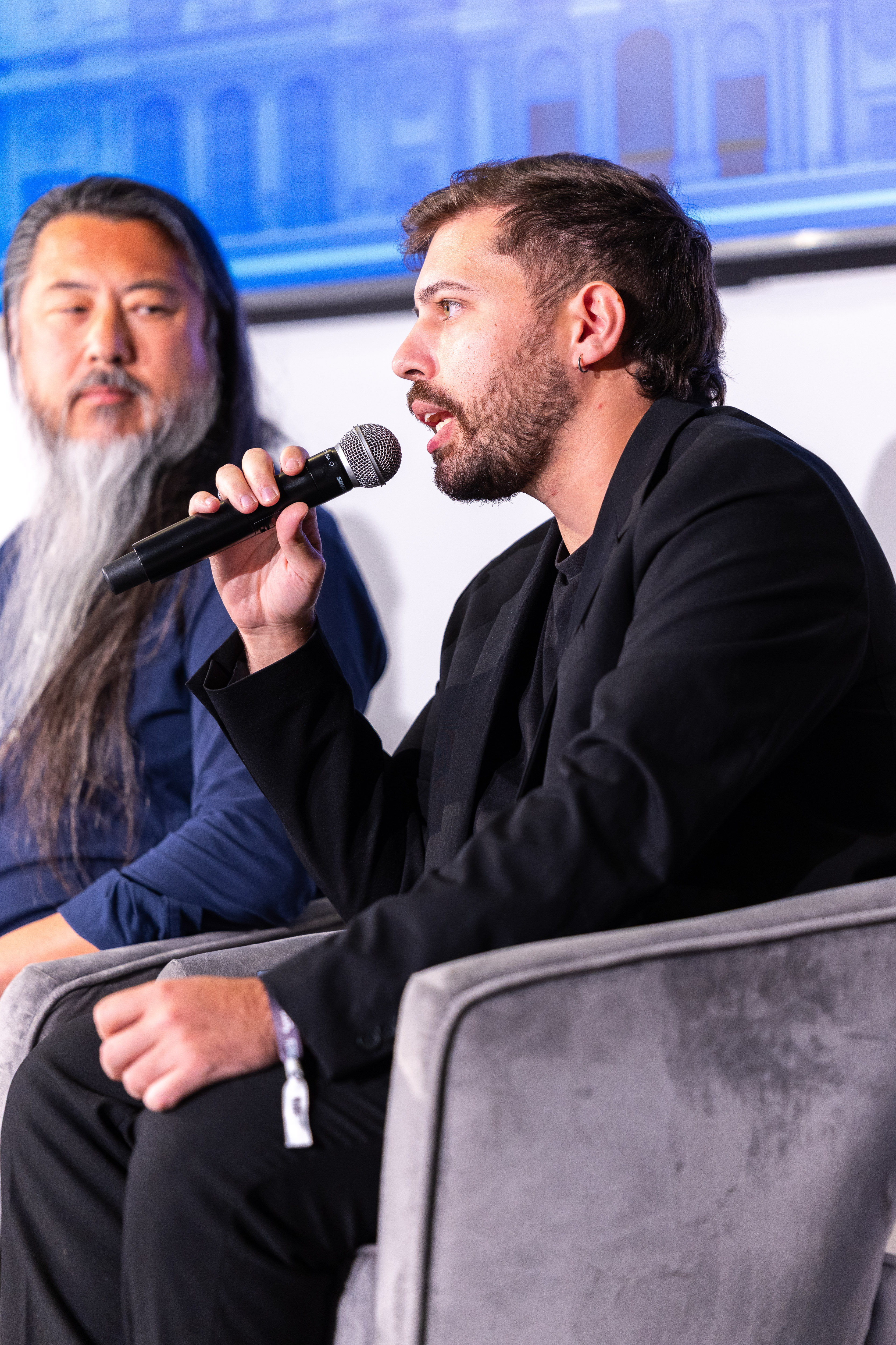 Thiago De Marco speaking on a panel